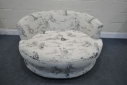 A MODERN CIRCULAR ORIENTAL PATTERNED SWIVEL CUDDLE CHAIR, with loose scatter cushions, diameter