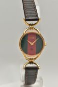 A 'GUCCI' WRISTWATCH, quartz movement, red and green round dial, signed 'Gucci', yellow metal