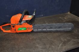 A CHARLES JACOBS 5800 VINTAGE PETROL CHAINSAW with 18in cut, and blade guard (engine pulls freely