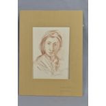 AN EARLY 20TH CENTURY PORTRAIT OF A CONTINENTAL FEMALE FIGURE, unsigned chalk on card, approximate