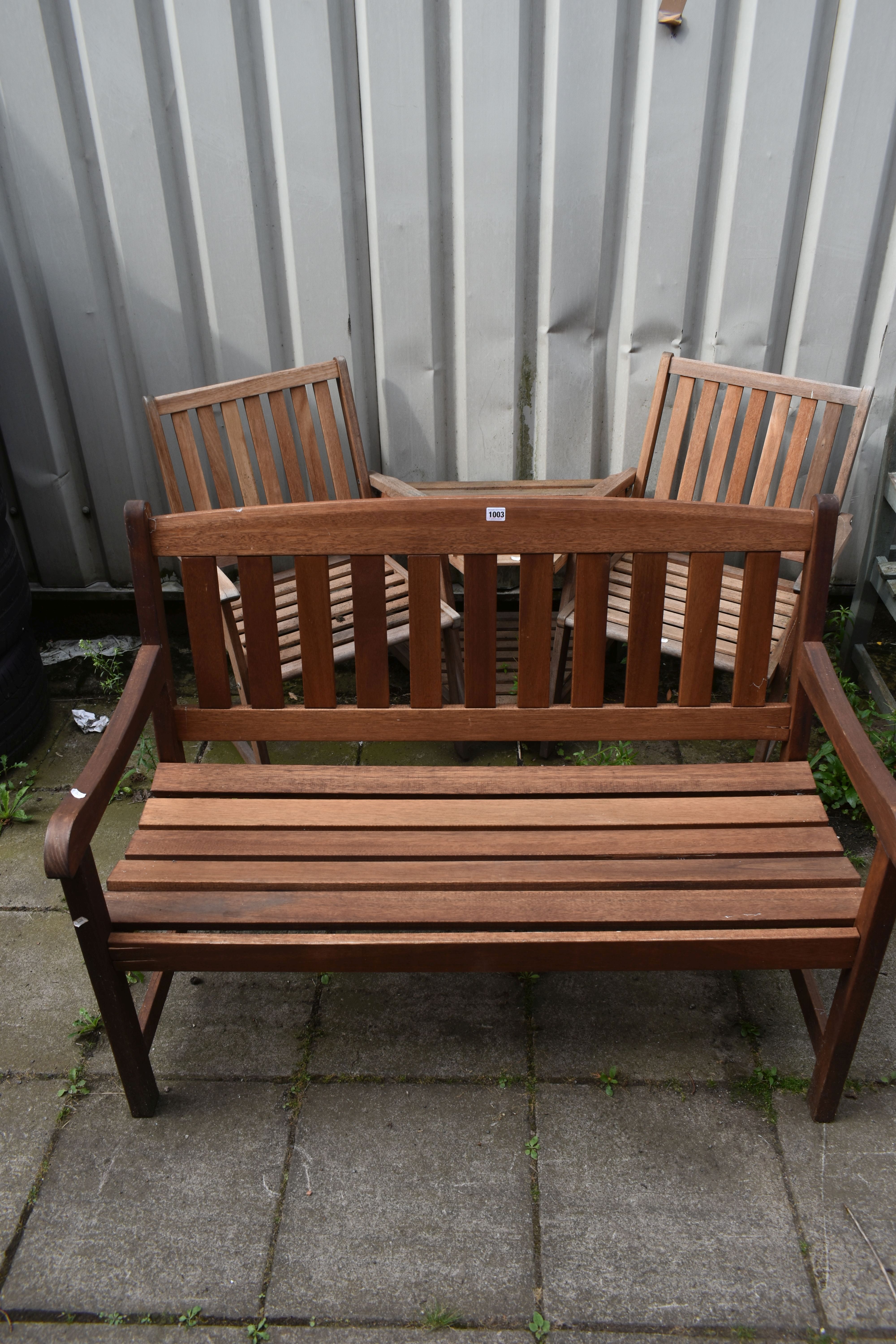 A STAINED TEAK SLATTED GARDEN BENCH, length 119cm, along with a two seater teak garden love seat/