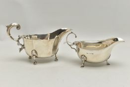 TWO GEORGE VI SILVER SAUCE BOATS, both with wavy rims, C scroll handles and on three cabriole legs