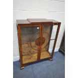 AN ART DECO TWO DOOR DISPLAY CABINET, on bracket feet, width 89cm x depth 30cm x height 113cm (