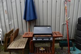 A SELECTION OF GARDEN ITEMS, to include an Outback Trekker gas barbeque and cover, a parasol, two