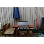 A SELECTION OF GARDEN ITEMS, to include an Outback Trekker gas barbeque and cover, a parasol, two