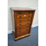 A VICTORIAN MAHOGANY WELLINGTON CHEST OF SEVEN GRADUATED DRAWERS, with turned handles, on a plinth