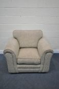 AN OATMEAL UPHOLSTERED ARMCHAIR