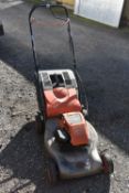 A FLYMO QUICKSILVER 40 PETROL LAWNMOWER, with grass box (condition - engine pulls but then goes
