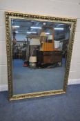 A LARGE GILT FRAMED BEVELLED EDGE WALL MIRROR, 154cm x 123cm (condition report: -good)