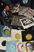 A CASE OF LPS AND THREE CASES OF SINGLES RECORDS, comprising approximately 60 LPs / 12 inch records,