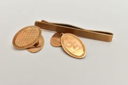 A CASED 9CT GOLD PAIR OF CUFFLINKS AND A TIE CLIP, Automotive Products Group Golden Jubilee case,