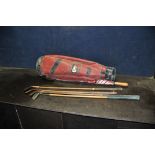 FOUR VINTAGE HICKORY SHAFTED GOLF CLUBS including a Tom Tropp Jigger, a brass topped putter and a