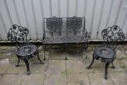 A CAST ALUMINIUM TWO SEATER GARDEN BENCH, with scrolled and foliate design to backrest, pierced
