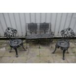 A CAST ALUMINIUM TWO SEATER GARDEN BENCH, with scrolled and foliate design to backrest, pierced