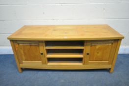 A LIGHT OAK TV STAND, with two fielded panel doors, width 130cm x depth 50cm x height 54cm (
