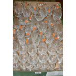 A GROUP OF CUT CRYSTAL DRINKING GLASSES, comprising a set of twelve wine glasses, a set of twelve