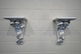 A PAIR OF PLASTER CORBELS, depicting a mythical semi-clad lady, width 32cm x depth 26cm x height