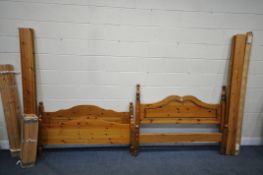 TWO 4FT6 PINE BEDSTEADS, with side rails and slats