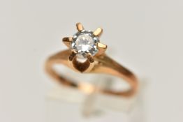 A YELLOW METAL CUBIC ZIRCONIA RING, a single circular cut, colourless cubic zirconia, in a raised