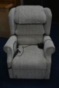 A BEIGE UPHOLSTERED ELECTRIC RISE AND RECLINE ARMCHAIR (PAT pass and working)