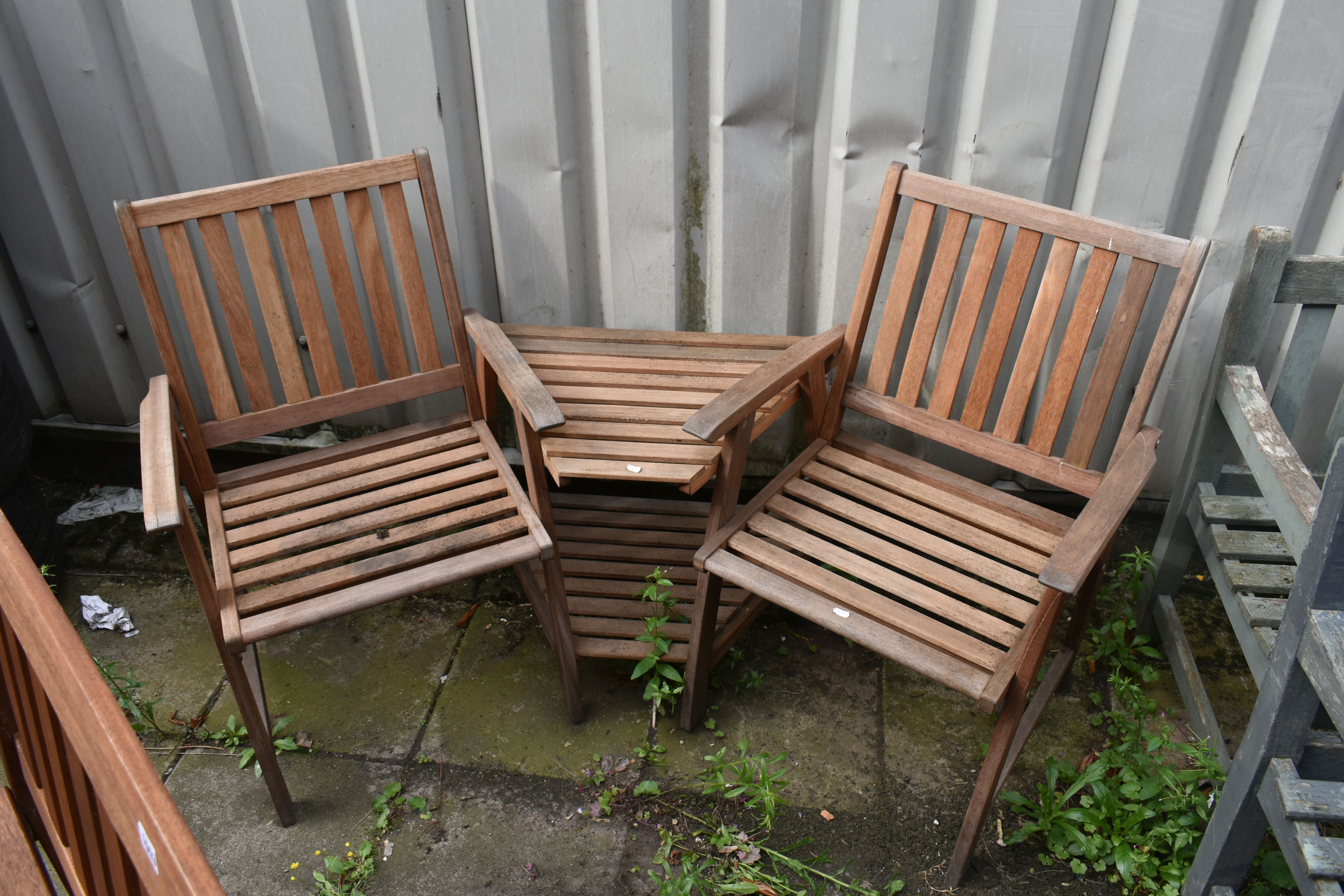 A STAINED TEAK SLATTED GARDEN BENCH, length 119cm, along with a two seater teak garden love seat/ - Image 4 of 4