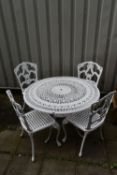 A WHITE PAINTED ALUMINIUM GARDEN CIRCULAR TABLE, with scrolled pierced details, on foliate legs,