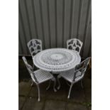 A WHITE PAINTED ALUMINIUM GARDEN CIRCULAR TABLE, with scrolled pierced details, on foliate legs,