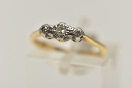 A YELLOW AND WHITE METAL THREE STONE DIAMOND RING, three single cut diamonds each illusion set in