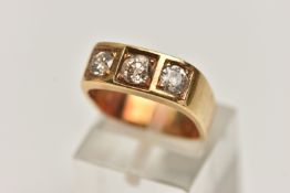 A YELLOW METAL THREE STONE DIAMOND RING, three old cut diamonds, each claw set in a square mount, to