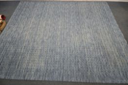 A LARGE MODERN NOURISON BLUE RUG, 320cm x 244cm, a modern cream rug, and a floral carpet runner (