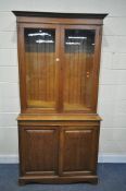 AN EARLY 20TH CENTURY OAK BOOKCASE, with a double glazed top, over fielded panel doors, width