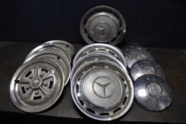 A COLLECTION OF VINTAGE HUB CAPS to include a set of four 10 '' Volkswagen, five 15 '' Mercedes