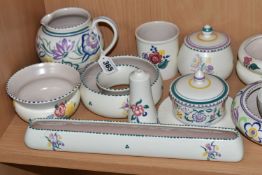 A COLLECTION OF POOLE POTTERY TRADITIONAL WARE, over thirty pieces to include posy rings, preserve