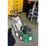 A BILLY GOAT LAWN VACUUM, with a Briggs and Stratton 625 petrol engine (pulls freely but not