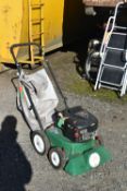 A BILLY GOAT LAWN VACUUM, with a Briggs and Stratton 625 petrol engine (pulls freely but not
