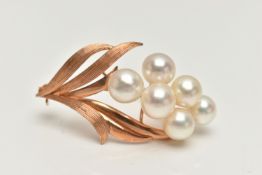 A YELOW METAL CULTURED PEARL BROOCH, floral design set with a cluster of six cultured white pearls