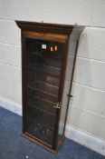AN EARLY 20TH CENTURY MAHOGANY HANGING COLLECTORS DISPLAY CABINET, enclosing four glass shelves,