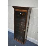 AN EARLY 20TH CENTURY MAHOGANY HANGING COLLECTORS DISPLAY CABINET, enclosing four glass shelves,