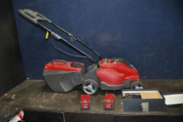 A MOUNTFIELD EL340 Li48 CORDLESS LAWN MOWER with grass box, two 48v batteries and one charger (PAT