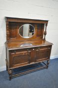 AN EARLY 20TH CENTURY OAK MIRROR BACK SIDEBOARD, with two drawers and cupboard doors, width 138cm