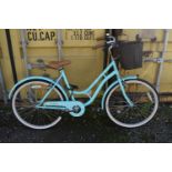 A TEAL BARRACUDA LACERTA HERITAGE SINGLE SPEED LADIES BYCICLE, with a wicker basket attached to