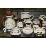 A COLLECTION OF DEVON MOTTO WARE, approximately sixty pieces to include a puzzle jug, a serving