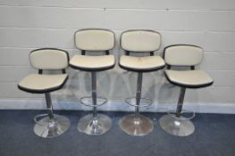A SET OF FOUR CREAM AND BLACK LEATHERETTE SWIVEL HIGH CHAIRS, on chrome bases (condition report: -