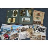 A BOX CONTAINING AN EDWARDIAN POSTCARD ALBUM AND CONTENTS, ASSORTED LOOSE POSTCARDS AND A PLAYERS