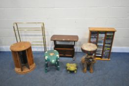A SELECTION OF OCCASIONAL FURNITURE, to include an oak magazine rack, pine cd rack with contents,