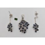 A PAIR OF WHITE METAL CLUSTER DROP EARRINGS AND MATCHING PENDANT WITH A LOOSE CUT STONE, each