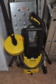 A KARCHER K2.125 PRESSURE WASHER with lance, two heads and patio cleaning head (PAT pass and