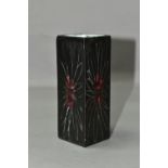 AN EARLY TROIKA ST IVES RECTANGULAR VASE, smooth oxide glaze, decorated with a wax resist daisy-like