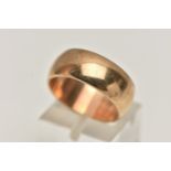 A YELLOW METAL BAND RING, a polished band, approximate width 8mm, unmarked, ring size N centre,