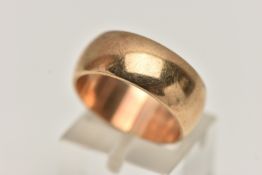 A YELLOW METAL BAND RING, a polished band, approximate width 8mm, unmarked, ring size N centre,
